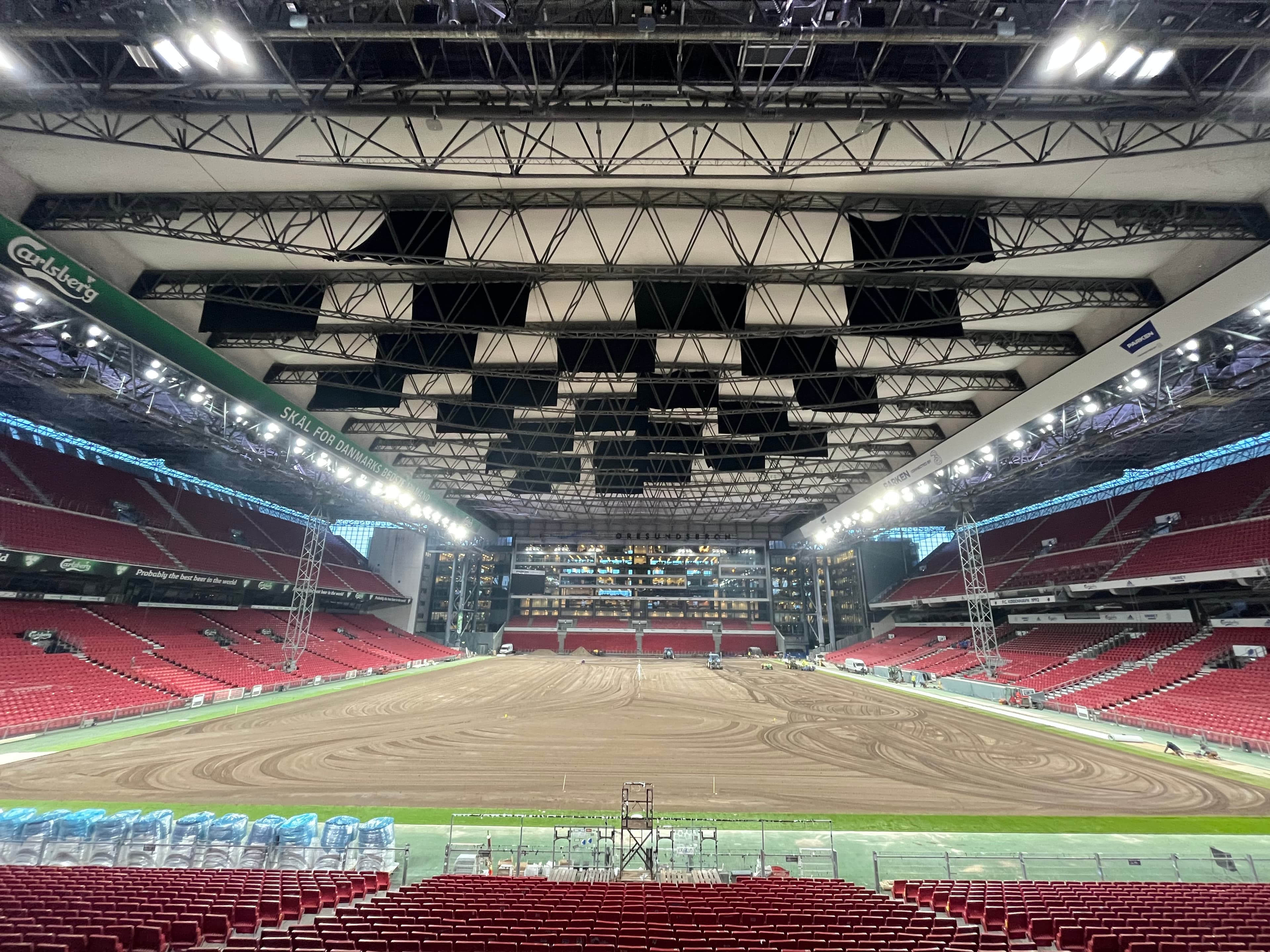 Prepared pitch construction surface inside Copenhagen’s stadium beneath its roof